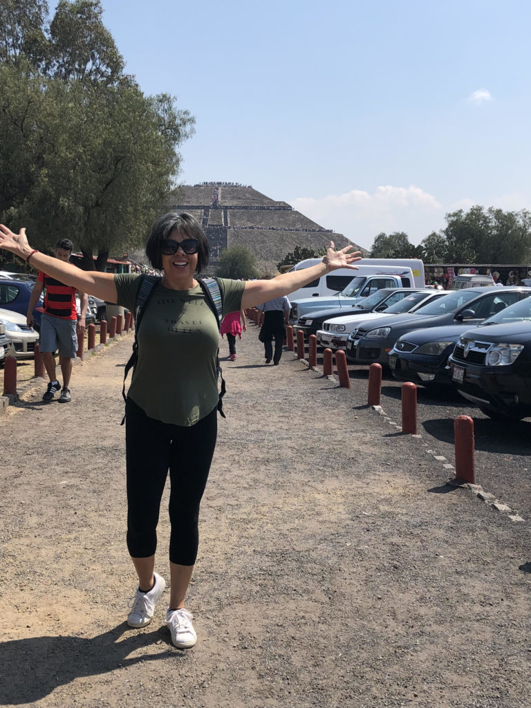 Yolanda taking in the Teotihuacan Sun and Moon Pyramids in Mexico